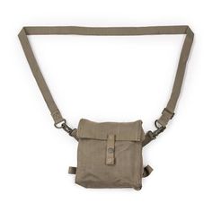 the waist bag is made from canvas and has an adjustable strap to hold it in place