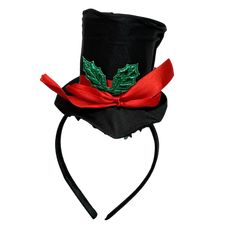 Step into the holiday spirit in style with our festive Top Hat Headband! This delightful accessory is perfect for adding a touch of elegance and fun to your seasonal celebrations. The headband features a mini black top hat adorned with a vibrant red ribbon and a festive green holly leaf embellishment. Whether you’re attending a Christmas party, holiday parades, or simply spreading cheer at home, this charming piece instantly elevates your festive attire. Crafted for comfort, the soft and sturdy Holiday Adjustable Fascinator, Holiday Mini Hats With Headband, Holiday Mini Hat Headband, Holiday Headband Mini Hats, Adjustable Headband For Holiday Festivities, Top Hat Headband, Holiday Parades, Festive Attire, Holiday Headbands