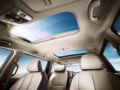 the interior of a car with two sunroofs and one skylight on