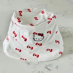 Shein Hello Kitty White Bucket Hat. This Super Cute Hello Kitty Bucket Hat Makes For The Perfect Finishing Touch To Any Look. This Super Cute Bucket Hat Comes In A Hello Kitty Red Print With A Wide Brim, And Canvas Construction. It Has An Adjustable Strap For A Perfect Fit. Excellent Conditions. Brand New With Tag Adjustable White Playful Bucket Hat, Playful White Adjustable Bucket Hat, Playful Adjustable White Bucket Hat, Cute White Bucket Hat For The Beach, Cute White Bucket Hat For Beach, Fun White Brimmed Mini Hats, Trendy White Bucket Hat, White Adjustable Kawaii Hat, Playful White Bucket Hat