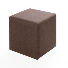 a brown cube sitting on top of a white floor