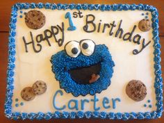 a birthday cake with an image of a cookie monster on it