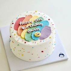 a birthday cake with colorful frosting and decorations