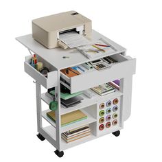 a computer desk with printer, scanner and other office supplies on it's shelf