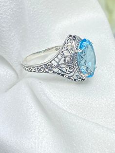 Natural Blue Topaz Ring, Marquise Gemstone, Art Deco Filigree, Sterling Silver Jewelry, Silver Embrace Jewelry, D201 Heirloom Blue Topaz Ring, Heirloom Sapphire Topaz Ring, Elegant Filigree Ring With Blue Topaz Gemstone, Elegant Handmade Sterling Silver Topaz Ring, Handmade Elegant Sterling Silver Topaz Ring, Heirloom Blue Topaz Ring Jewelry, Classic Filigree Blue Topaz Rings, Classic Blue Topaz Filigree Ring, Elegant Turquoise Topaz Gemstone Ring