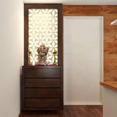 a wooden cabinet sitting next to a white door in a room with wood flooring