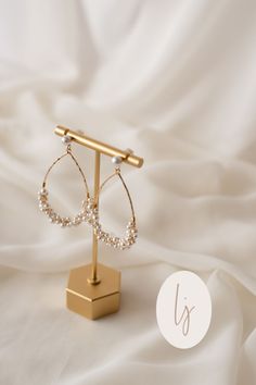 Get ready to turn heads! These gorgeous Iris Gold Earrings | Luna & ade are the perfect accessory to add that extra sparkle to any outfit. Pin now to remember this must-have jewelry piece! White 14k Gold Filled Bridal Earrings For Wedding, Oval Pearl Charm Jewelry For Weddings, White 14k Gold-filled Pearl Earrings For Wedding, White 14k Gold Filled Pearl Earrings For Wedding, 14k Gold Filled Drop Earrings For Wedding, 14k Gold Filled White Bridal Earrings For Wedding, 14k Gold Filled Pearl Earrings For Wedding, Teardrop 14k Gold-filled Pearl Earrings For Anniversary, 14k Gold Filled Teardrop Pearl Earrings For Anniversary