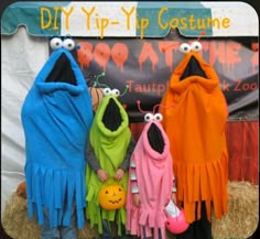 three children dressed in costumes standing next to each other