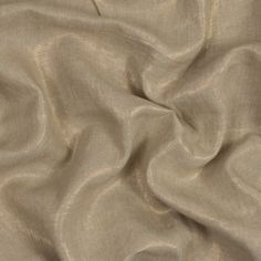 a close up view of a beige fabric