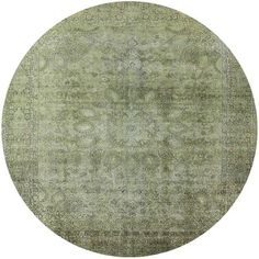 a round rug with an ornate design in green and beige colors on a white background