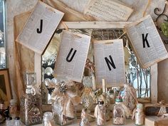 there are many books hanging on the wall with letters and numbers above them that spell out junk