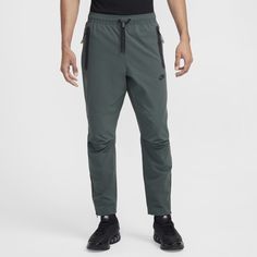 Made with stretchy, sweat-wicking fabric, these tapered pants offer a clean Nike Tech look. A roomier fit through the seat and thighs tapers to the zippered ankle. Classic Tech details dial in the look. Man Weave, Tie Styles, Nike Tech, Bolo Tie, Tapered Pants, Nike Sportswear, Lightweight Fabric, Black Fashion, Top Brands