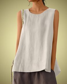 Embrace effortless style and comfort with the PRAGUE Linen Top, a perfect blend of simplicity and elegance. This sleeveless linen tank top features a classic round neck and an oversized fit, making it an ideal choice for casual wear. Crafted from a soft cotton-linen blend, it offers breathability and ease, perfect for warm weather. Whether you're going for a laid-back look or dressing up for an outing, this retro-inspired top is versatile and timeless. Premium Linen-Cotton Blend: Soft and breathable fabric for ultimate comfort. Sleeveless Design: Ideal for layering or wearing on its own in warm weather. Round Neck: Classic and flattering neckline that suits any style. Oversized Fit: Relaxed and comfortable, perfect for a casual, chic look. Retro Style: Vintage-inspired design that adds a t Casual Sleeveless Solid Color Blouse, White Sleeveless Top With Pockets, Solid Color Linen Sleeveless Tank Top, Solid Linen Sleeveless Tank Top, Sleeveless Linen Tank Top, Casual Plain Tank Top For Summer, Summer Sleeveless Blouse With Pockets, Plain Sleeveless Top For Spring, Casual Sleeveless Tops With Pockets