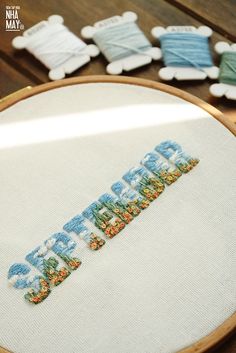 a close up of a embroidery on a table