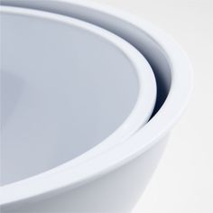 three white bowls stacked on top of each other