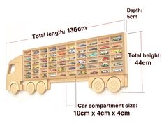 a wooden toy truck is shown with measurements for the size and width, as well as its