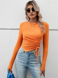 Orange Ribbed Crew Neck Top, Casual Orange Ribbed Top, Trendy Long Sleeve Orange Top, Fitted Long Sleeve Orange Top, Orange Ribbed Tops For Spring, Trendy Orange Long Sleeve Top, Trendy Orange Winter Tops, Fitted Orange Top For Fall, Trendy Orange Fall Tops