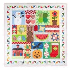 a quilted wall hanging with many different things on it's sides, including pumpkins and snowmen