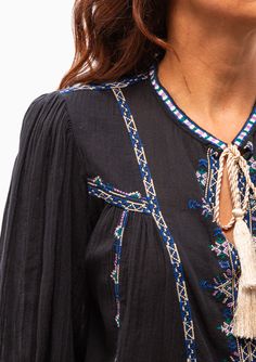 The Silekia Top by Isabel Marant Étoile is a multicolored embroidered long sleeve blouse. Boasting multi colored embroidery throughout, light colored tassels on the V-Neck collar and long, slightly capped sleeves. Pair with any trouser or jean. 100% Cotton | Tassel: 100% Viscose | Embroidery: 100% Viscose Dry Clean Model is 5’8” and wearing a size 34. Runs true to size, we recommend taking your usual size. Model’s Measurements: 26” waist 34” hips 34" bust Isabel Marant Embroidery, Greek Clothes, Borders Design, Capped Sleeves, Isabel Marant Etoile, Fashion Diy, Fashion Story, Embroidered Top, Neck Collar