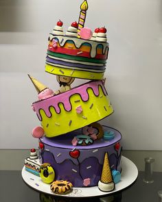 there is a multi layer cake that has been decorated with ice cream and icing