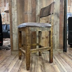 a wooden chair sitting on top of a hard wood floor