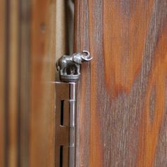 an open door with a metal handle on it