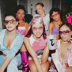 a group of young women sitting next to each other