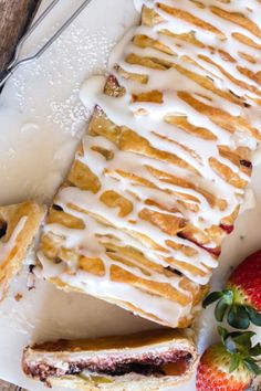 a plate topped with dessert next to strawberries