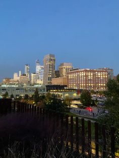 the city skyline is lit up at night