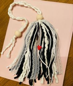 Black and white yarn and white lace with a hidden red ceramic heart bead inspired by one of my favorite Bible verses “Above all else, guard your heart, for everything you do flows from it” 
Proverbs 4:23 Bible Bookmarks Diy Ribbons, Diy Ribbon Bookmarks, Tassel Bookmark Diy, Tassle Bookmarks, Diy Bible Tassels, Bible Tassel Bookmark Diy, Bible Bookmarks Diy, Diy Yarn Tassel, Bookmark Journal