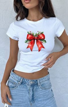 Christmas Coquette Bow Baby Tee, Christmas Season Crop Top, Christmas 2024 Tee, New year Tank Top,Christmas Light Coquette Bow Crop Top,FF75 🎉 Welcome to Fleeky Tee! Your Custom Shirt Dreams Come True! 🎉 We are dedicated to making you smile! At Feelky Tee, we specialize in creating and customizing shirts exactly how you envision them. Our shirts make fantastic gifts for loved ones, family, coworkers, or even for yourself! If you can dream it, we can design it! Our shirts are ideal for bachelor Cute White Holiday Tops, Cute White Top For Festive Occasions, White Christmas Letter Print Tops, White Letter Print Top For Holiday, Red Short Sleeve Tops As Gift, White Letter Print Tops For Holiday, Cute White Christmas T-shirt, Red Crew Neck Top For Gift, Casual Festive Tops For New Year