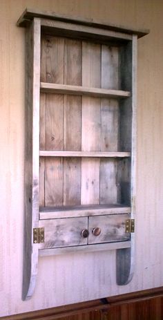 an old wooden shelf with drawers on it