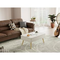 a living room filled with furniture and a guitar