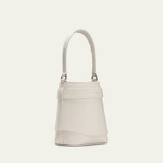 Givenchy "Shark Lock" bucket bag in leather  Features signature padlock accent  Flat top handle  Detachable chain crossbody strap  Open top  Approx. 5.5"H x 5.5"W x 2.7"D Made in Italy Modern White Bucket Box Bag, Designer Bucket Bag With Silver-tone Hardware, Designer Top Handle Bucket Bag With Silver-tone Hardware, Designer Bucket Bag With Chain Strap, Leather Bucket Evening Bag With Detachable Strap, Luxury Handheld Bucket Bag For Formal Occasions, Luxury Formal Handheld Bucket Bag, Luxury White Evening Bucket Bag, Luxury Evening Bag With Detachable Strap In Bucket Shape