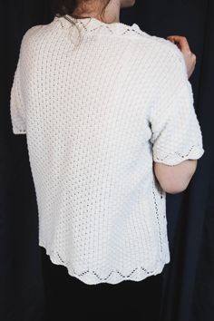 "80s/90s very cute vintage short sleeve sweater top in white knit, a perfect summer cottagecore sweater top Size L / M , or wear it as an oversize. Great vintage condition, no flaws, no stains, clean and ready to wear. Model in the photo is an EU 38 size (S/M) ● Era : late 80s/early 90s ● Label : Berkertex ● Fabric composition % : no tags but surely cotton by texture and weight ● Size on tag : no size tag ● How it fits : soft and nice cotton knit in white ● Condition : very good vintage conditio Cream Short Sleeve Sweater With Pointelle Knit, Cream Open Knit Crew Neck Top, Pointelle Knit Crew Neck Blouse, Cream Textured Knit Top With Short Sleeves, White Knit Blouse With Crew Neck, Cream Short Sleeve Knit Sweater, White Short Sleeve Knit Cardigan, Crochet Knit Crew Neck Top, White Knitted Short Sleeve Sweater