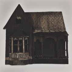 an old black and white photo of a house