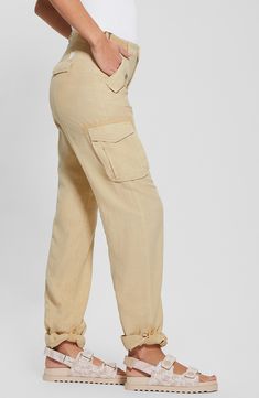 Rock a modern, casual-cool vibe in these lightweight cargo pants designed with belted sides and roll-tab cuffs. 30" inseam; 8" leg opening; 10 1/2" front rise; 15" back rise Zip fly with button closure Front slant pockets with decorative flaps; cargo bellows flap pockets; back flap pockets; back zip pocket Adjustable buckle side tabs Roll-tab cuffs Partially lined 70% lyocell, 30% linen Machine wash, tumble dry Imported Relaxed Fit Linen Cargo Style Bottoms, Relaxed Fit Linen Cargo Bottoms, Beige Linen Cargo Bottoms, Spring Mid-rise Cargo Pants With Flap Pockets, Casual Linen Parachute Pants With Cargo Pockets, Utility Linen Cargo Pants With Cargo Pockets, Straight Leg Linen Cargo Pants, Straight Linen Cargo Pants With Pockets, Linen Cargo Pants For Work