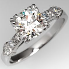 Circa 1930s ring is centered with one (1) old European cut diamond weighing 1.14 carats and set into a four-split prong head. The shoulders of the ring are each accented with three (3), bead set, round single cut diamonds. The ring measures 6.8mm at the top, rises 5.7mm above the finger, tapering to 2.0mm wide and 1.0mm thick at the base of the shank. The ring is currently a size 4.5 and we offer complimentary resizing to fit. Classic Gia Certified Cushion Cut Diamond Ring, Classic Platinum Diamond Ring With Cushion Cut, Vintage Gia Certified White Gold Diamond Ring, Vintage Diamond Ring With Cushion And Brilliant Cut, Vintage Gia Certified Diamond Ring With Round Band, Vintage Cushion Cut Platinum Diamond Ring, Vintage Cushion Cut Diamond Ring With Brilliant Cut, Vintage Gia Certified Round Cut Rings, Vintage Gia Certified Diamond Ring