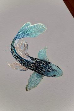 a drawing of a blue fish with white spots on it's body and tail