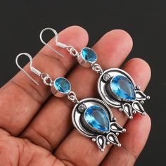 ".Blue Topaz Gemstone Earring 925 Sterling Silver Handmade Jewelry Earring gift for Women., Antique Silver Earring :Welcome To Store:- Metal             :-    Sterling Silver Total Weight  :-    8 Gram Over Main Stone    :-    Blue Topaz Stone Size     ;-     10/14 mm Pear, 8 mm Round Color              :-    Silver Type               :-    Earring's Metal Purity   :-    925 Theme:Angels, Beach, Beauty, Biker Occasion:Anniversary, Birthday, Christening, Christmas, Confirmation/Communion, Engagement, Father's Day, Graduation, Mother's Day, Valentine's Day                                                  -:Shipping Handling:- Handling Time:- We take handling time of 2 to 3 Business Day from the date of receipt of the payment after receiving cleared payment. Shipping Services:- We use Standar Silver Topaz Teardrop Earrings, Silver Teardrop Topaz Earrings, Silver Topaz Dangle Earrings, Blue Topaz Dangle Earrings For Gift, Topaz Drop Earrings Gift, Topaz Drop Earrings For Gift, Topaz Dangle Earrings For Gift, Antique Silver Earrings, Handmade Dangle Earrings