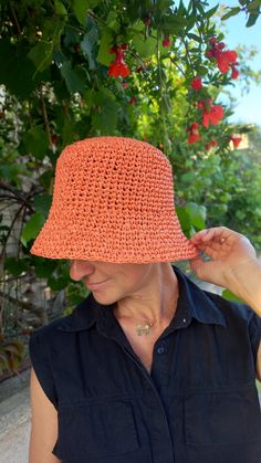 We present to you a crocheted raffia hat in peach color.   Why a bucket raffia hat?  Because it is an environmentally friendly material, the hat is lightweight, breathable, and can be folded into a bag and taken with you on a trip or vacation.  A hat can be a great gift for your loved ones. Hat weight is about 100 grams. You will feel comfortable on the beach and will provaid reliable protection from the sun. Hat size: for head circumference 55-56 cm, 21,6-22 inches. You an contact me to order t Casual Orange Crochet Hat For Summer, Orange Beach Hat With Curved Brim, Casual Orange Crochet Hat For Beach, Orange Crochet Hat For Spring, Orange Short Brim Hat For The Beach, Casual Orange Crochet Beach Hat, Orange Summer Straw Hat For Vacation, Orange Brimmed Sun Hat For Vacation, Orange Bucket Hat For Spring Vacation