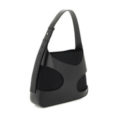 a black handbag on a white background with the handle extended to it's side