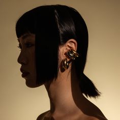 These ear cuffs are the best accessory to elevate any casual look and give you a bold, edgy style. Pair them up with our best-selling Bagel Hoops to create the perfect ear stack. Made from 18k Gold and Rhodium Plated Stainless Steel. 18k Gold Plated and Rhodium Plated Stainless Steel Tarnish Resistant. Hypoallergenic and Non-reactive. Water Resistant. Yellow Gold Single Ear Cuff In Metal, Trendy Yellow Gold Ear Cuff, Chic Gold Ear Climbers, Gold Plated Ear Cuff For Party, Gold Plated Single Ear Cuff For Party, Chic Metal Ear Cuff, Modern Gold Ear Cuff For Party, Edgy Gold Cartilage Earrings, Yellow Gold Single Ear Cuff For Party