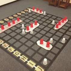 a board game with red and white pieces