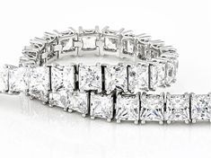 Bella Luce® white diamond simulant 28.38ctw square, rhodium over sterling silver tennis bracelet. Measures approximately 6.75, 7.25, and 8" L x 0.19" W and has a hidden box clasp closure. The diamond equivalent weight is 17.20ctw. Rectangular Diamond Cut Tennis Bracelet, Luxury Rectangular Diamond Cut Tennis Bracelet, Rectangular Diamond Tennis Bracelet With Accents, White Gold Rectangular Tennis Bracelet For Anniversary, Fine Jewelry White Gold Rectangular Tennis Bracelet, Rectangular Diamond Cut Bracelet For Wedding, Rectangular White Gold Diamond Bracelet, Rectangular Diamond Cut Wedding Bracelet, Formal Rectangular Diamond Tennis Bracelet