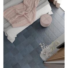 an aerial view of a bedroom with blue tile floors