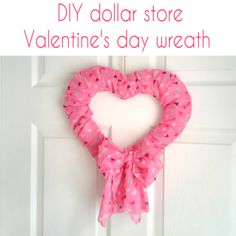 a valentine's day wreath hanging on a door with the words diy dollar store valentine's day wreath