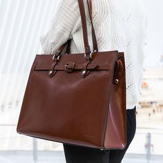 FREE GROUND SHIPPING & FREE MONOGRAMMING!SCRATCH & STAIN RESISTANT ITALIAN LEATHERCarry your files, folders, and mobile devices to work inside this sleek handmade Milano Alexis Leather Business Tote Bag. Each piece is handcrafted from scratch and stain resistant Italian leather. Its structured body has a wide gusset for greater capacity and long flat handles that make it easy and comfortable to carry on the shoulder. This tote bag has a roomy main section with secure top zip closure and a fully Elegant Briefcase With Palladium Hardware For Everyday Use, Modern Briefcase With Palladium Hardware, Modern Briefcase With Palladium Hardware For Everyday, Timeless Tote Briefcase For Daily Use, Business Leather-lined Tote Satchel, Timeless Briefcase With Leather Handles For Daily Use, Office Briefcase With Palladium Hardware, Timeless Rectangular Laptop Bag For Daily Use, Timeless Rectangular Briefcase For Daily Use