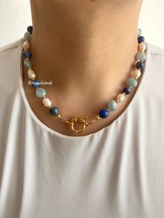 ✨Gold-Plated Necklace with Lapis Lazuli, Aquamarine, and Freshwater Pearls | 16.5 inches Add a touch of elegance to your style with this stunning **Gold-Plated Necklace** featuring a harmonious blend of **Lapis Lazuli **Aquamarine and **Freshwater Pearls**. Designed to be versatile, this piece transitions effortlessly from daily wear to special occasions. ✨ **Materials & Design   Crafted from high-quality gold-plated materials, this necklace offers a luxurious and durable finish. The combination of **Lapis Lazuli** and **Aquamarine** creates a striking harmony of blue tones, while the **Freshwater Pearls** add a timeless and elegant touch. 💙 **Elegant Blue Tones   The deep blue of **Lapis Lazuli** complements the soft, serene hues of **Aquamarine creating a perfect balance of color. Toget Blue Gemstone Pearl Necklace, Blue Pearl Necklaces With Gemstone Beads, Blue Pearl Necklace With Natural Stones, Blue Round Jewelry With Pearl Charm, Blue Round Pearl Charm Jewelry, Blue Pearl Necklace With Natural Stones For Gift, Blue Pearl Necklace With Natural Stones As A Gift, Blue Jewelry With Pearl Charm And Round Beads, Blue Pearl Necklace With Charm For Jewelry Making