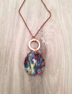 This boho style necklace features a copper pendant that has been hammered, shaped and textured, and fire painted using a propane torch to bring out the different colors in the metal. NOTE:  Certain lighting will bring the colors out more than other types of lighting. It is finished with a 1" copper hoop and comes with a 24" copper chain. It will ship in a gift box or bag via USPS with tracking info provided Propane Torch, Boho Style Necklaces, Fire Painting, Copper Pendant, Copper Necklace, Types Of Lighting, Copper Chain, Copper Pendants, Style Necklace